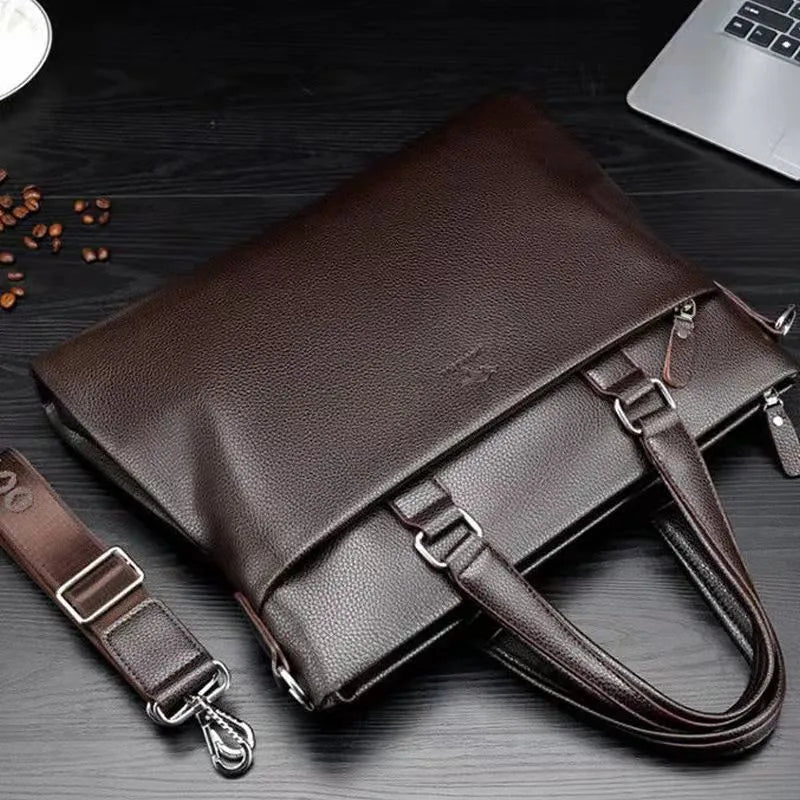 Men's black PU leather business messenger bag with shoulder strap showing spliced panel design.