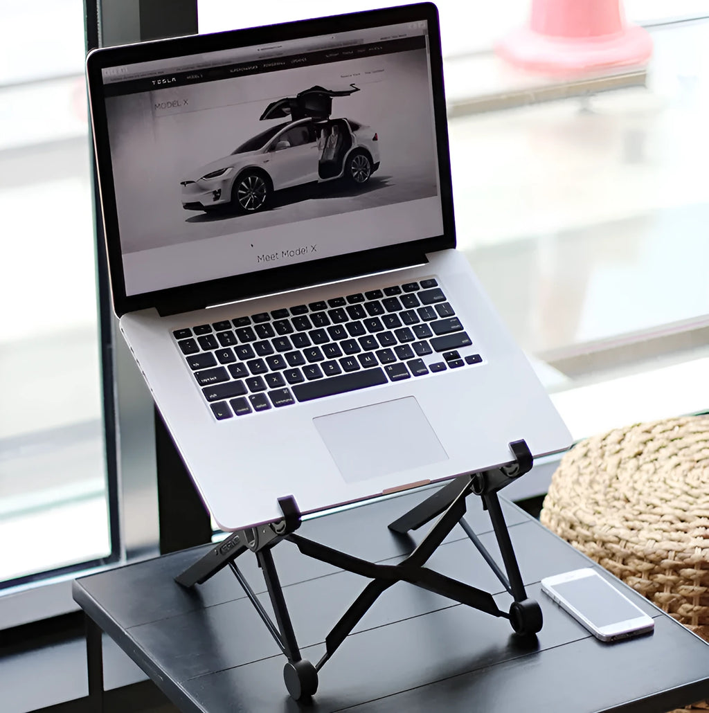 Black folding laptop stand with adjustable height mechanism and reinforced nylon construction