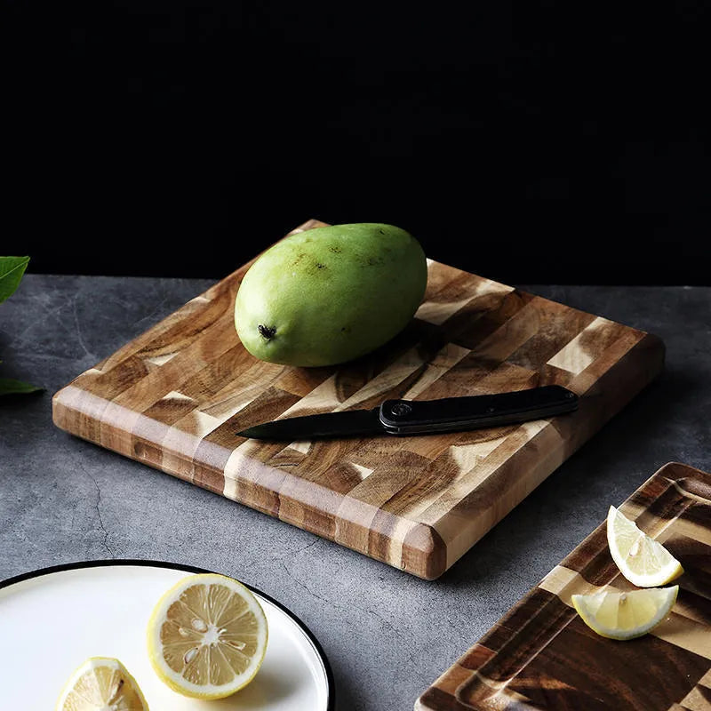 Brown solid acacia wood chopping board with 3cm thickness on a kitchen countertop