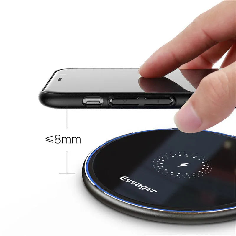 Black wireless charging pad with LED indicator light for smartphones and headphones