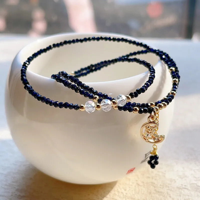 Blue sand stone cut three-ring bracelet with gold-tone metalwork, manual processing details visible