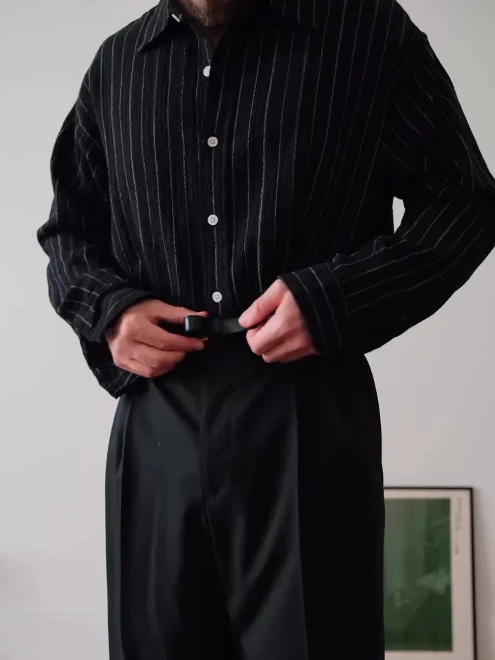 Man's black and white pinstriped long sleeve formal button-down shirt