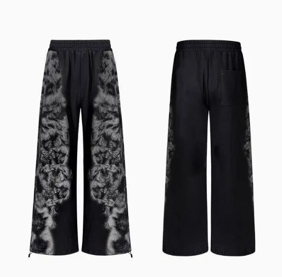 Loose fit printed street style trousers set with hoodie on a neutral background