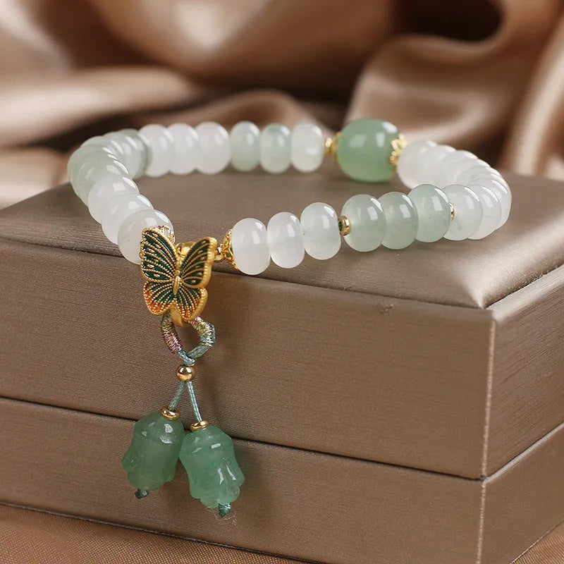 Green women's bracelet with Tian Shan Cui abacus beads and butterfly tassel