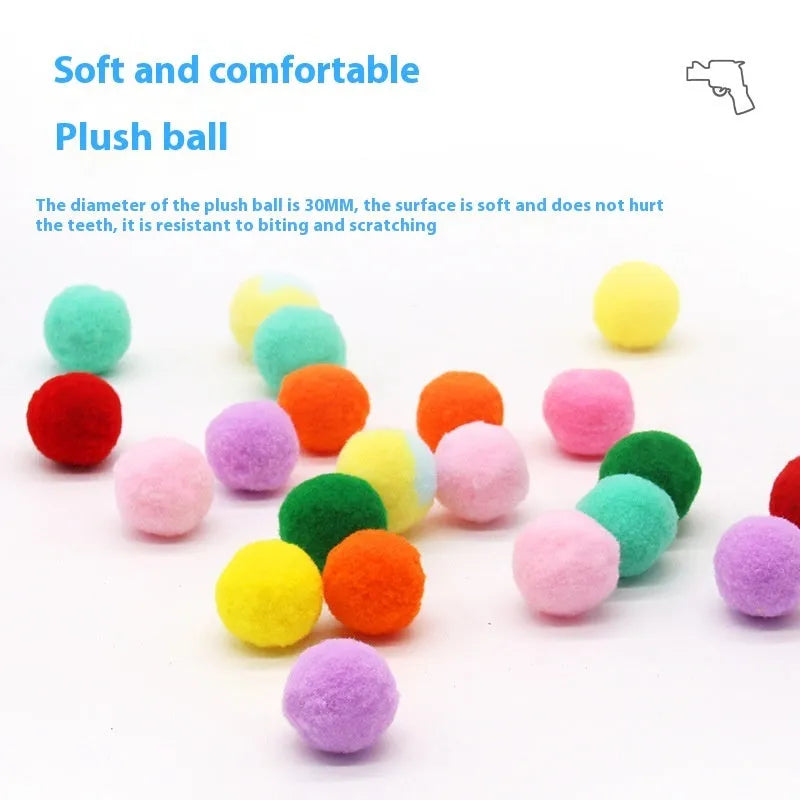 Pet toy set showing 30cm plush launcher gun and several soft 3cm yarn balls for dog fetch games