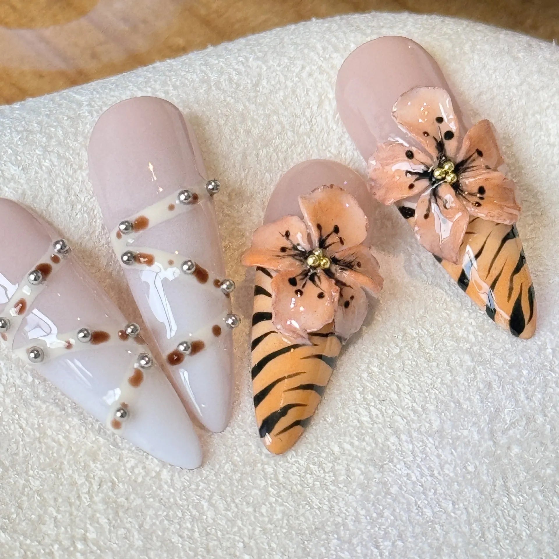 Handmade gel nail stickers with leopard, cross, and flower prints in a pack of ten.