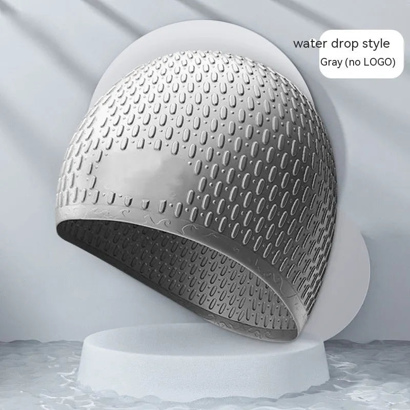 Silicone swimming cap for adults in various solid colours on a white background.