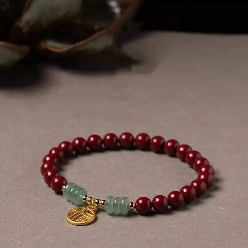 Handcrafted cinnabar bracelet with wave pattern design and copper bead accents in traditional Chinese style
