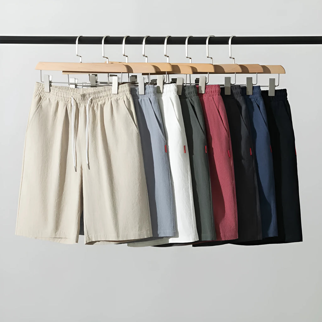 Solid colour cotton linen cropped summer pants with a drawstring waistband on a hanger.