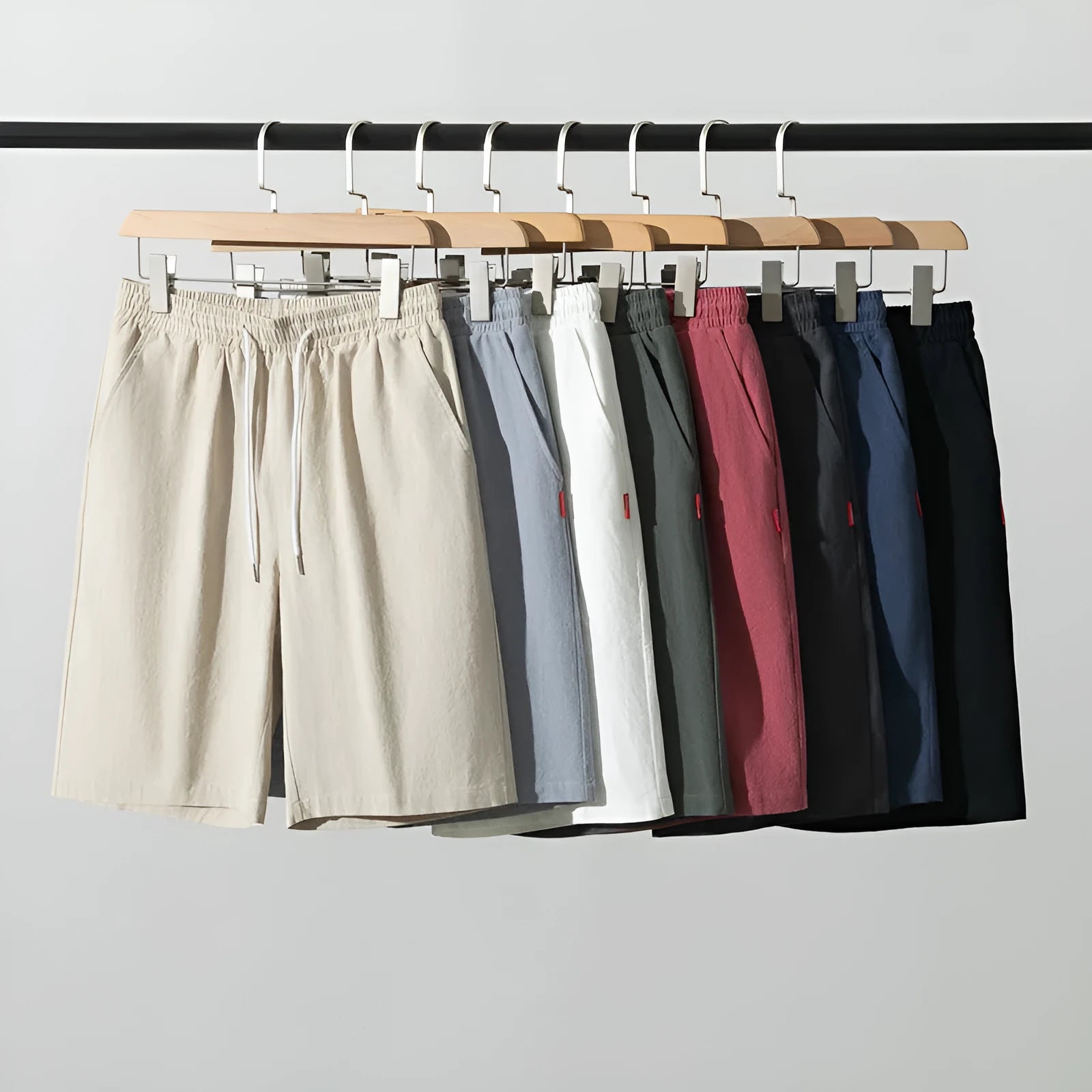 Solid colour cotton linen cropped summer pants with a drawstring waistband on a hanger.
