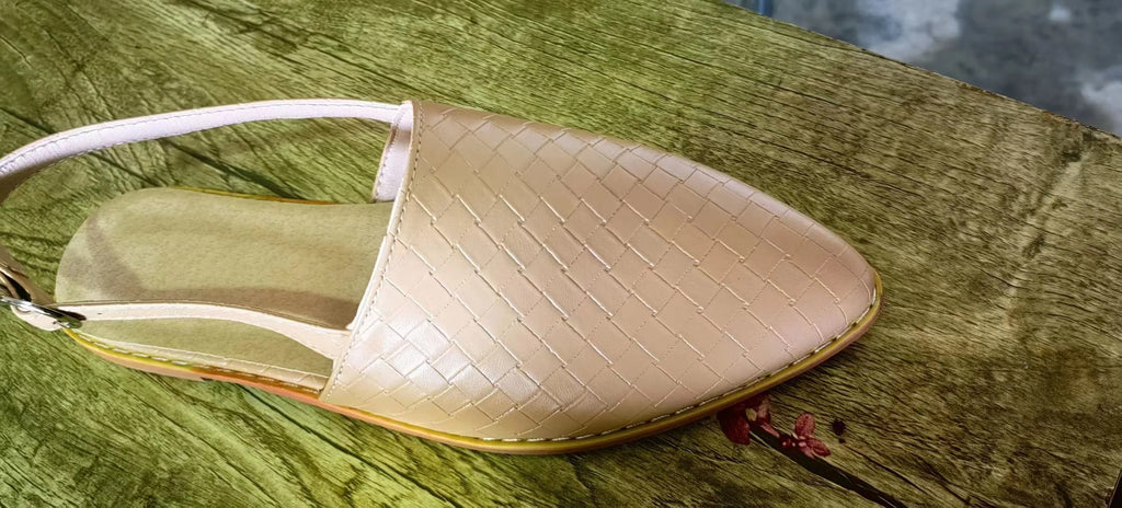 Women's black pointed toe flat sandals with a silver buckle closure on a microfiber upper.