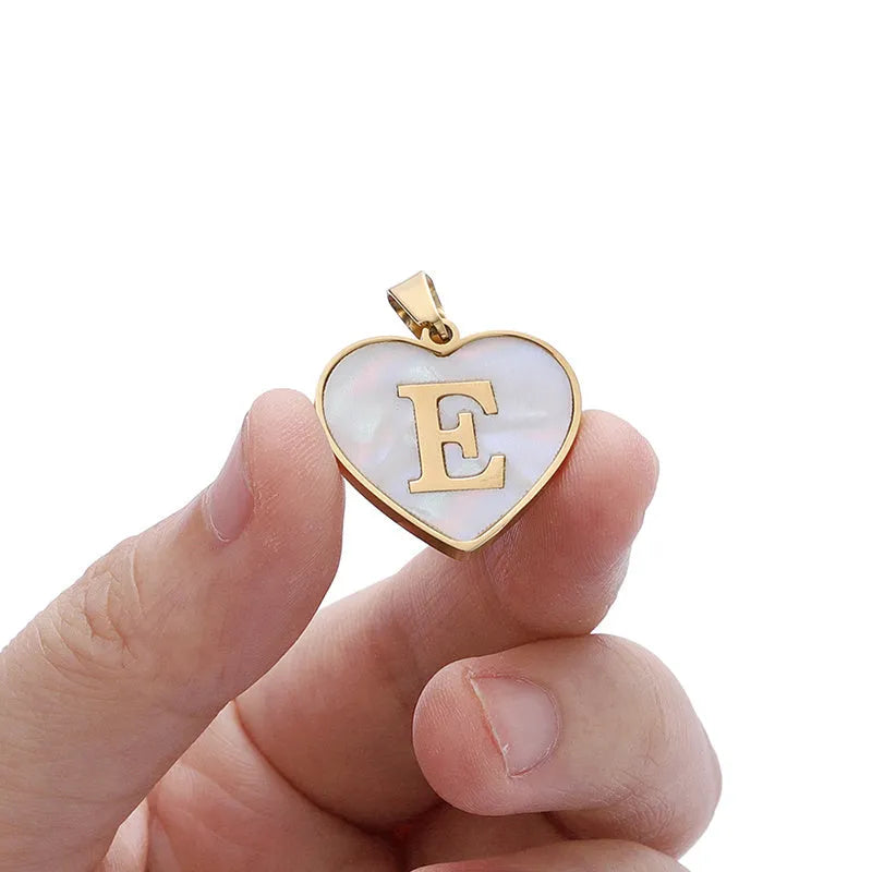 Gold plated heart necklace with white shell centre on a 45+5cm chain