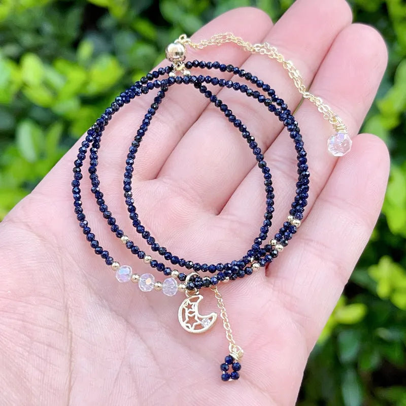 Blue sand stone cut three-ring bracelet with gold-tone metalwork, manual processing details visible