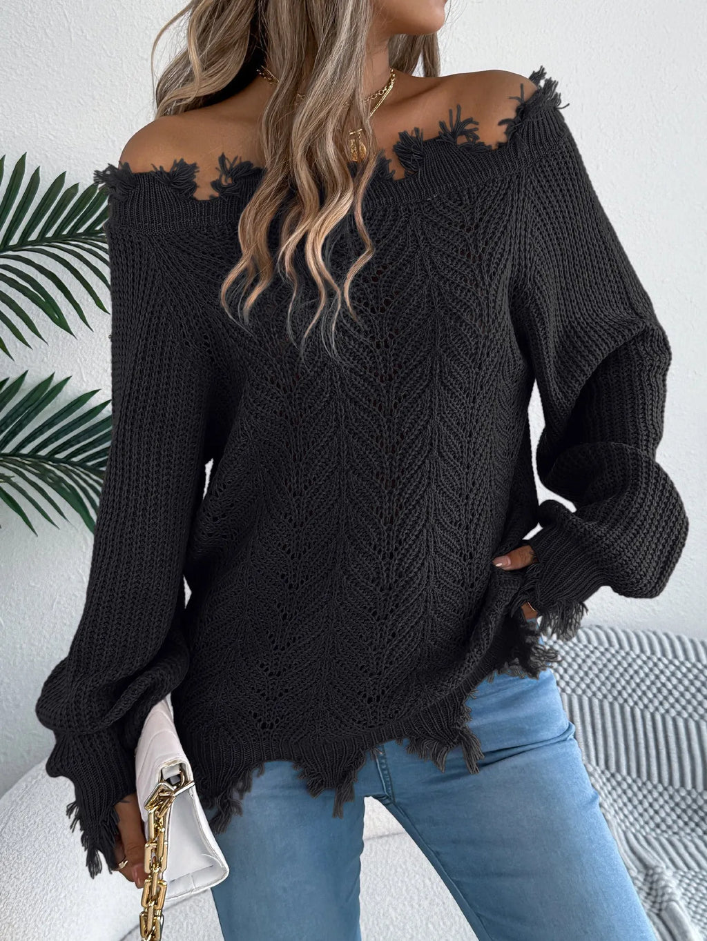 White hollow-out pullover sweater with cut off-the-shoulder design and long sleeves
