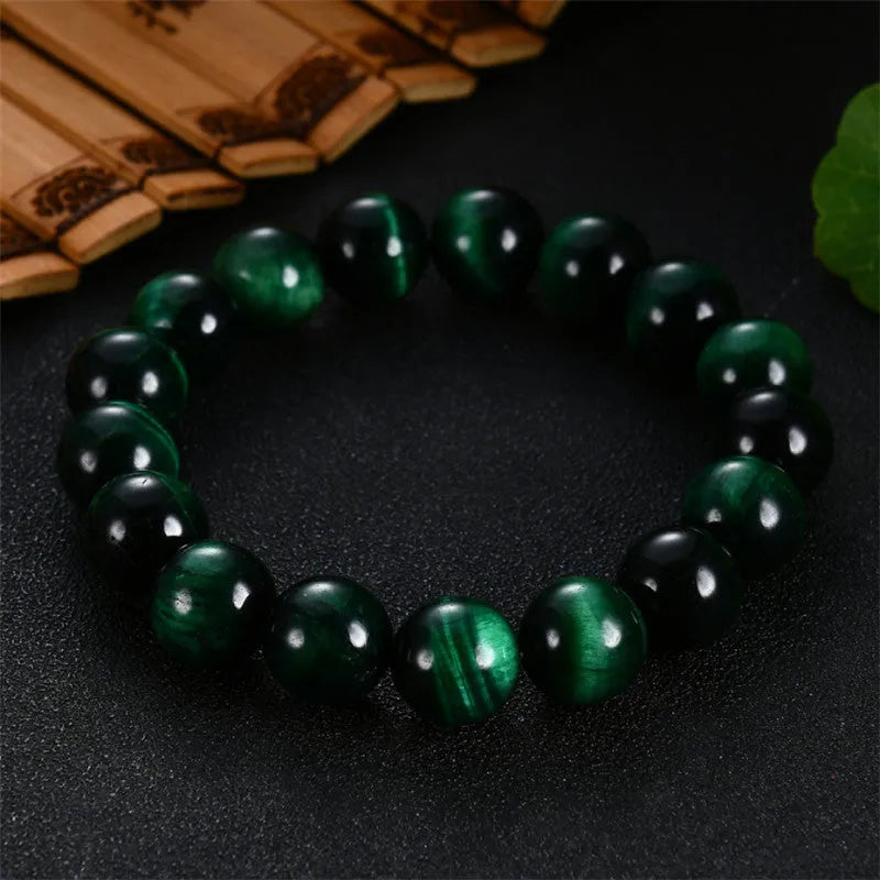 Green tiger eye stone bracelet with geometric beads in polished finish