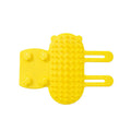 Silicone cat grooming comb with adjustable strap mounted on table leg, showing rounded teeth for pet hair removal