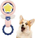 Set of four pink rubber dog chew toys with textured surfaces for dental cleaning