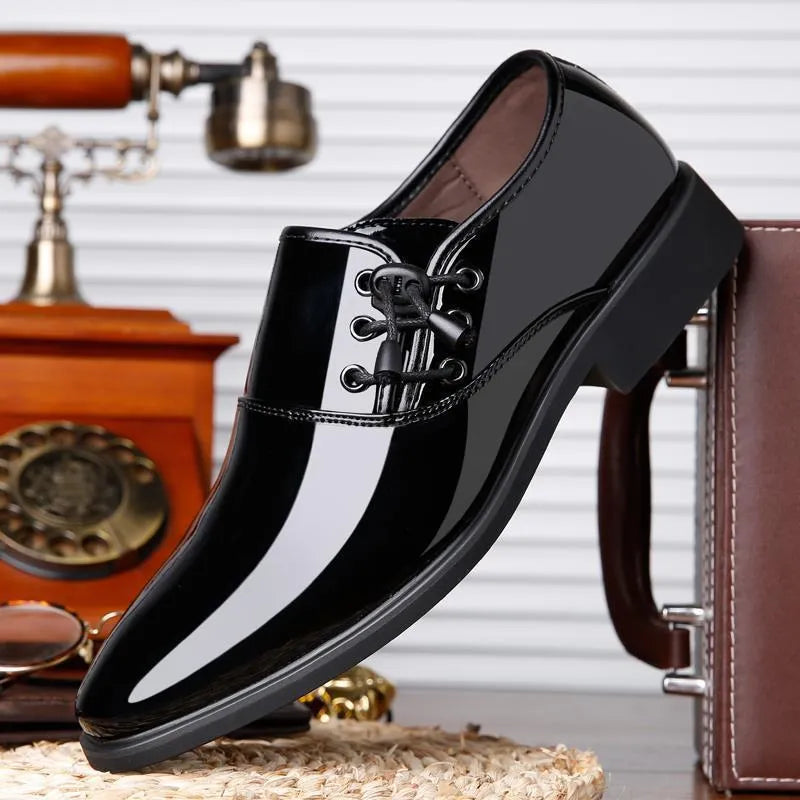 Men's black formal slip-on shoes with a round toe and square heel on a rubber sole.