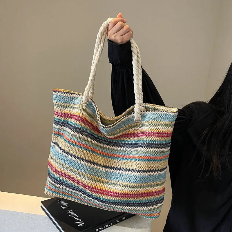 Blue straw woven single-shoulder bag with nylon construction and polyester lining.
