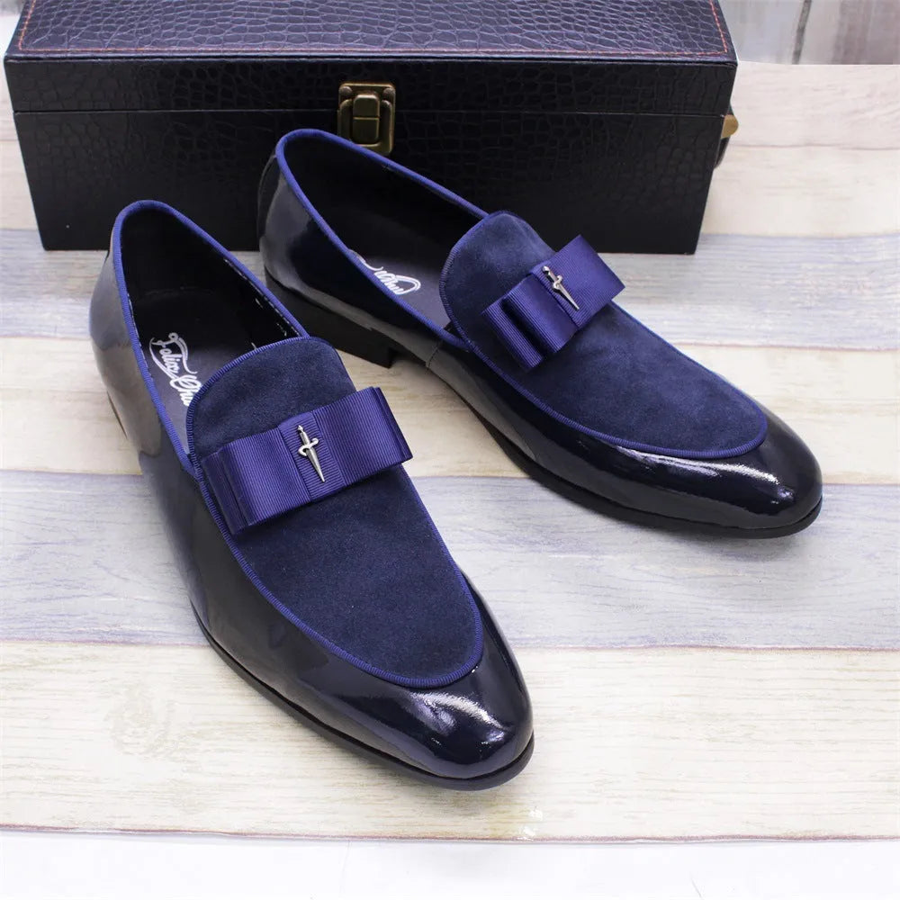 Men's glossy black patent leather low-top shoes with a tassel detail on a rubber sole.