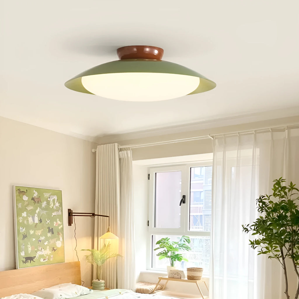 Modern minimalist flying saucer ceiling lamp with a shallow dome iron shade in a cream colour.