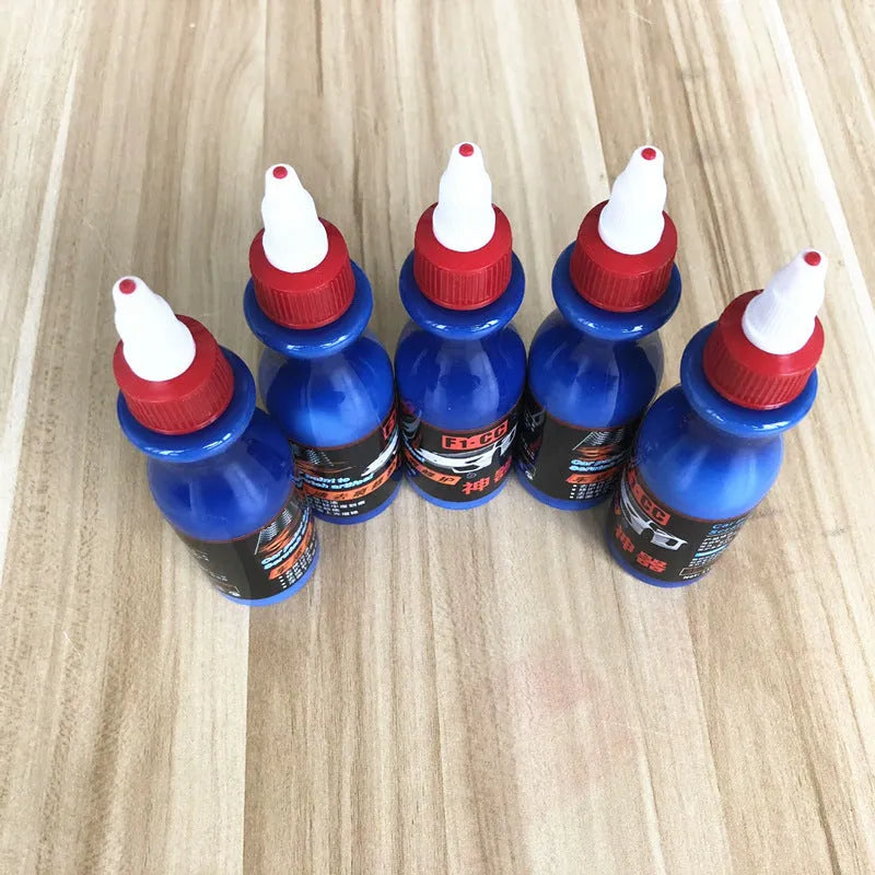Blue car scratch repair kit with applicator tool for automotive paint touch-ups