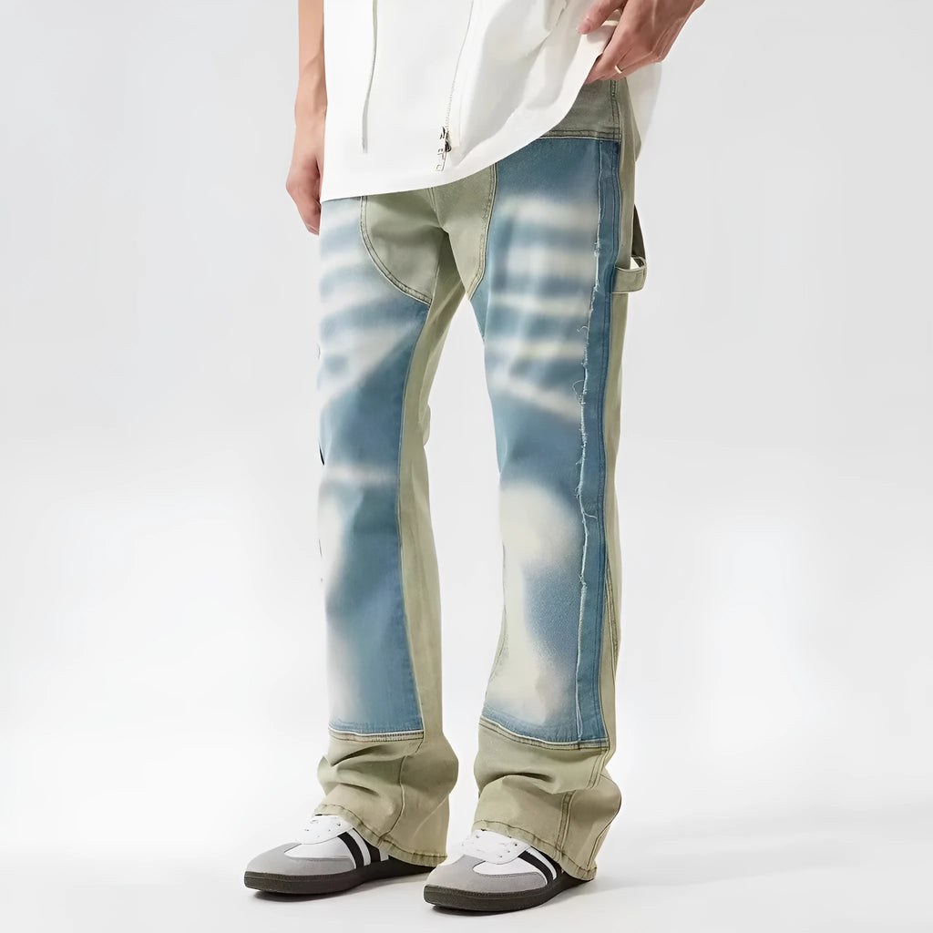 Men's yellow and blue patchwork jeans with a retro splash-ink damaged design on the legs.
