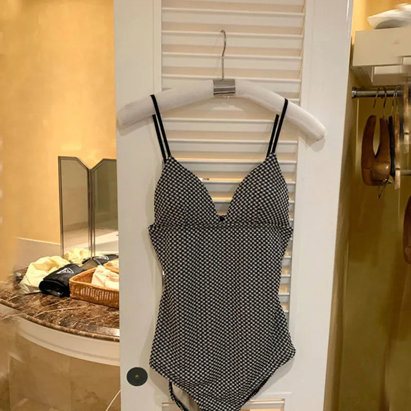 Blue and black one-piece swimsuit for covering belly and small chest.