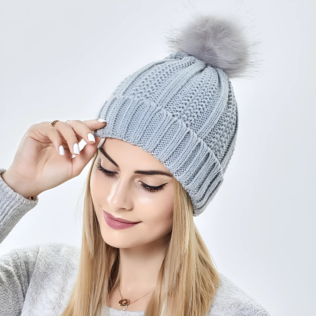 Wool skull knit beanie with satin lining and faux fur pom pom in various colours