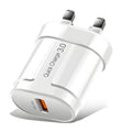White international smart phone charger with UK plug on a wooden surface