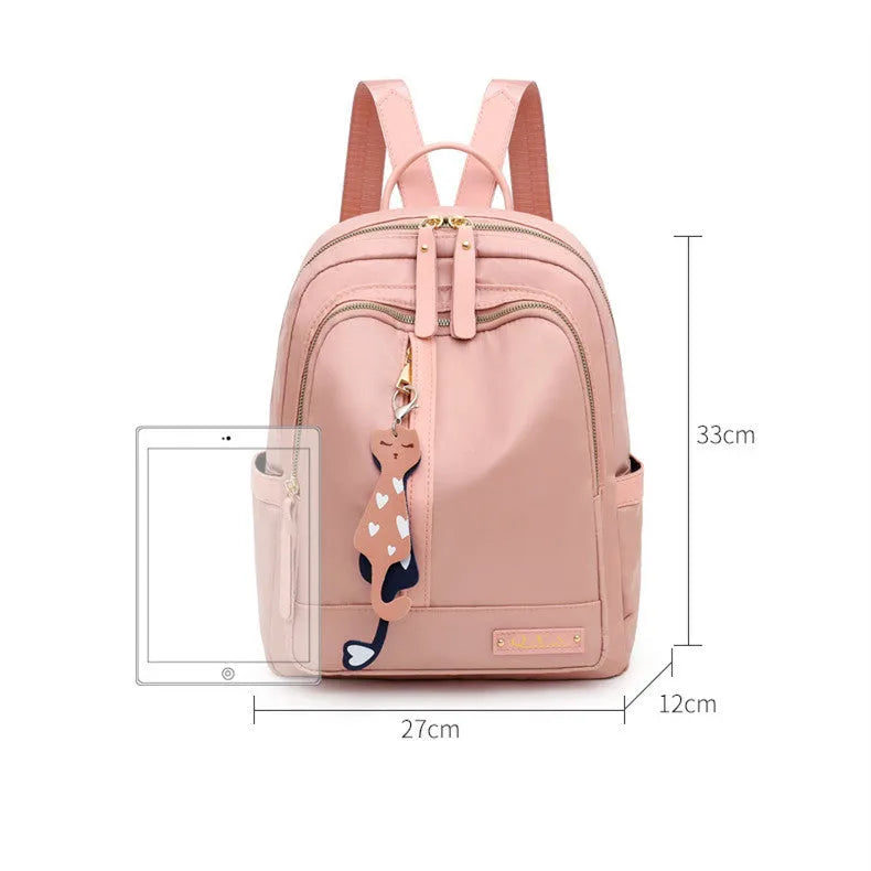 Women's nylon casual backpack in black with double shoulder straps and front pocket