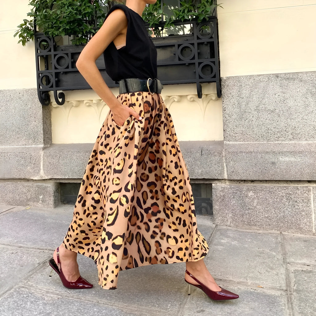 Brown leopard print women's A-line long skirt with elastic waistband on hanger