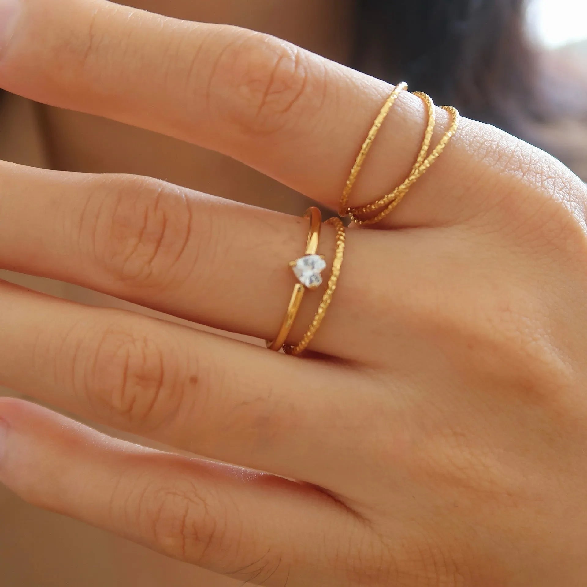 Golden electroplated stainless steel ring with love heart and oval designs for women