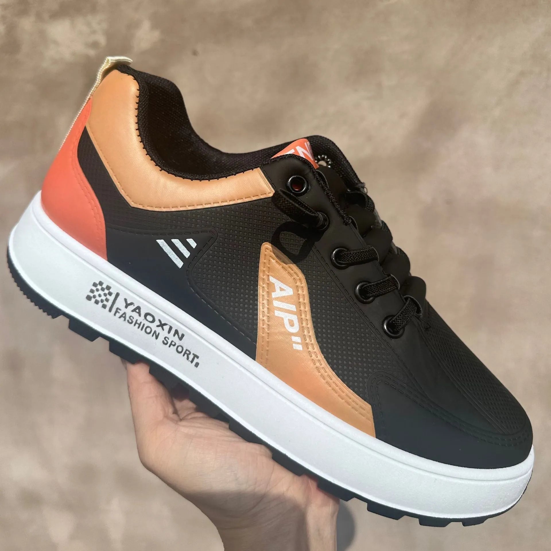 Men's solid colour casual shoes with artificial PU upper in white and orange, white and black, and white and brown colourways.