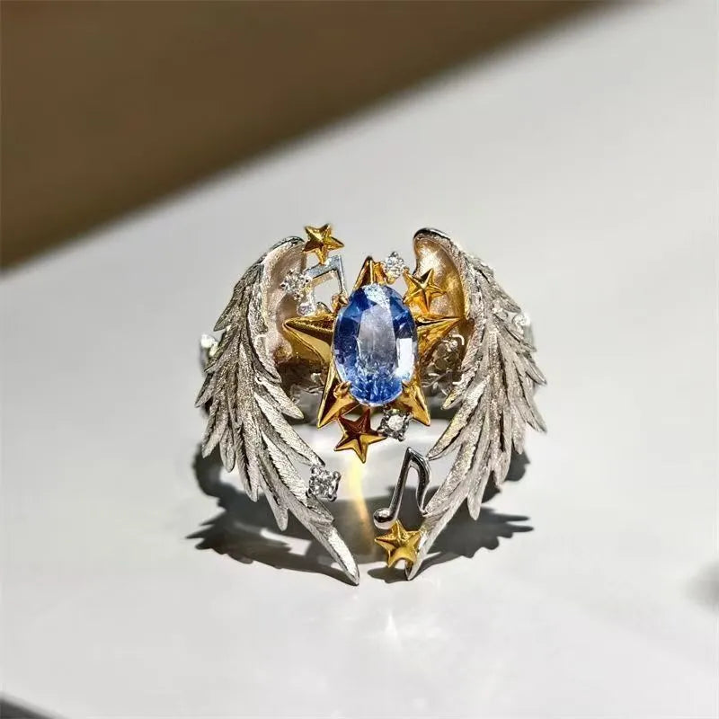 Adjustable ring with geometric angel wings pattern and open mouth design