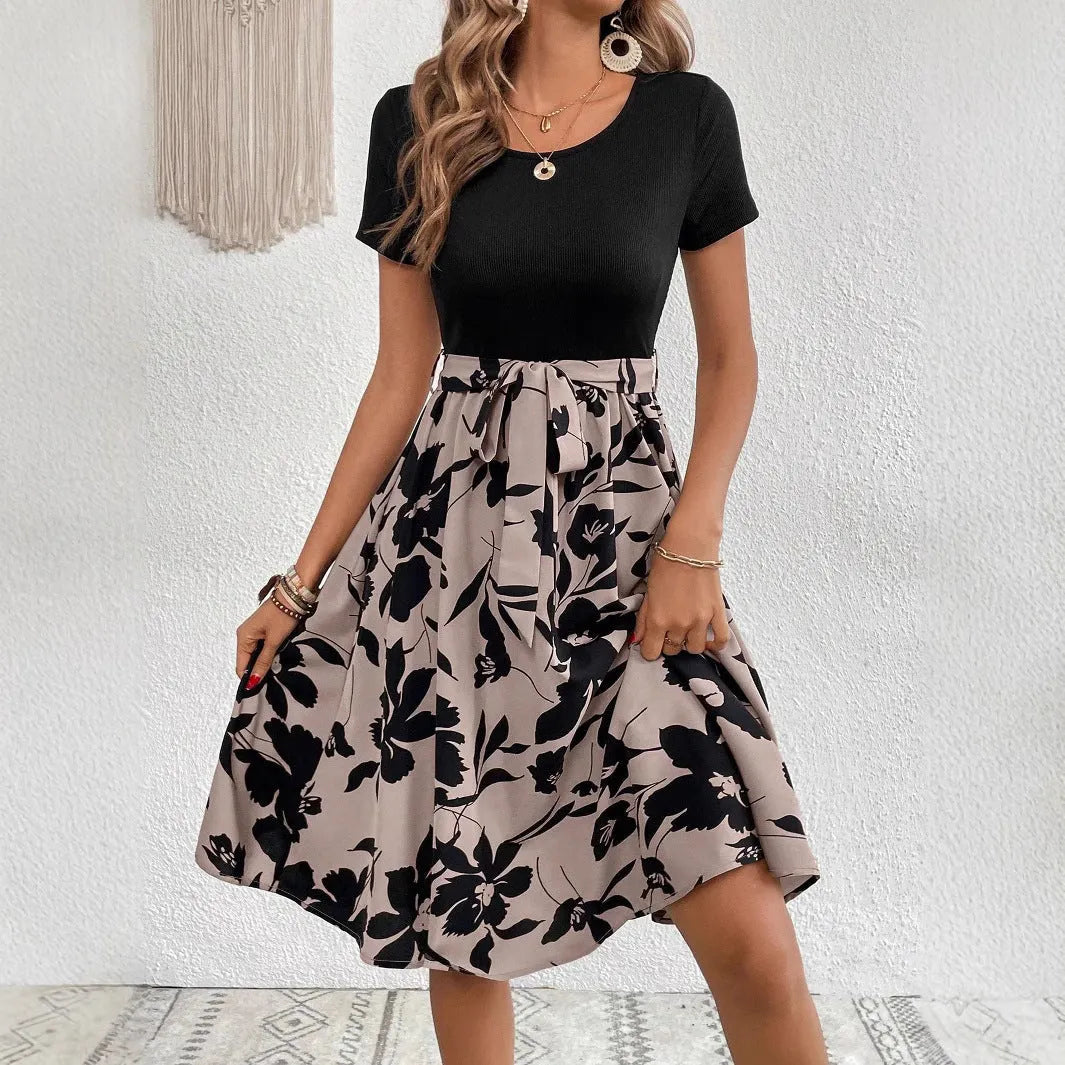 Women's khaki casual dress with plant print, A-line skirt, and shoulder strap detailing