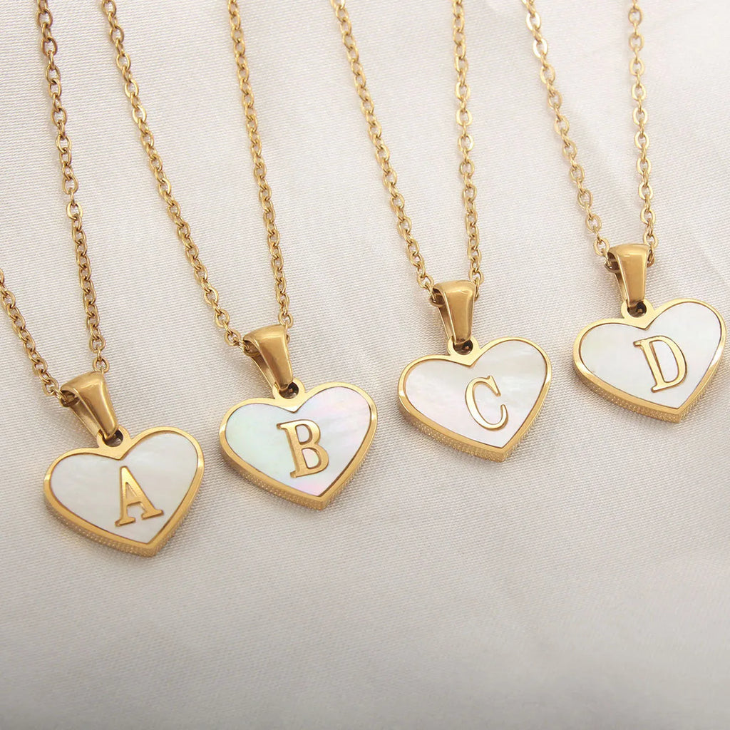 Gold plated heart necklace with white shell centre on a 45+5cm chain