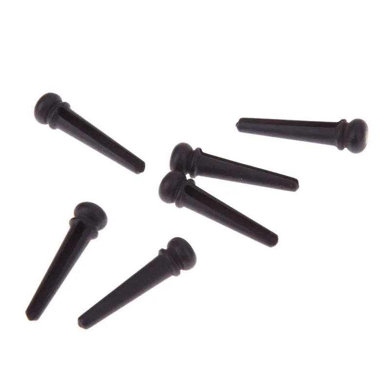 Six ebony guitar string nails with matt black finish for folk acoustic guitars