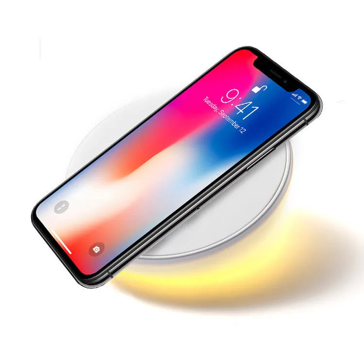 White wireless phone charger with digital clock display and alarm function