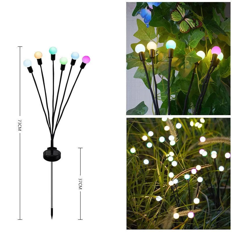 Solar-powered LED ground spike garden light with automatic sensor in lawn
