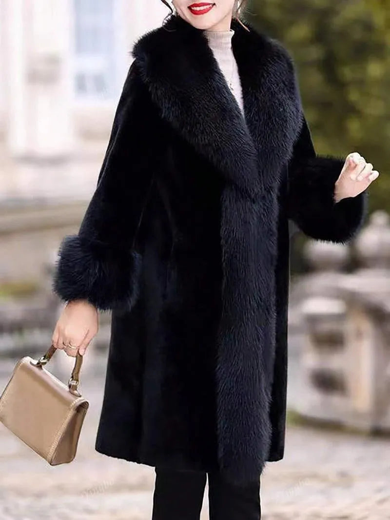 A gray women's mid-length coat with thick faux rabbit fur, leather panels, and a faux fur collar.