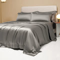 Solid colour Tencel Lyocell bed linen set with quilt cover and pillowcases on a bed.