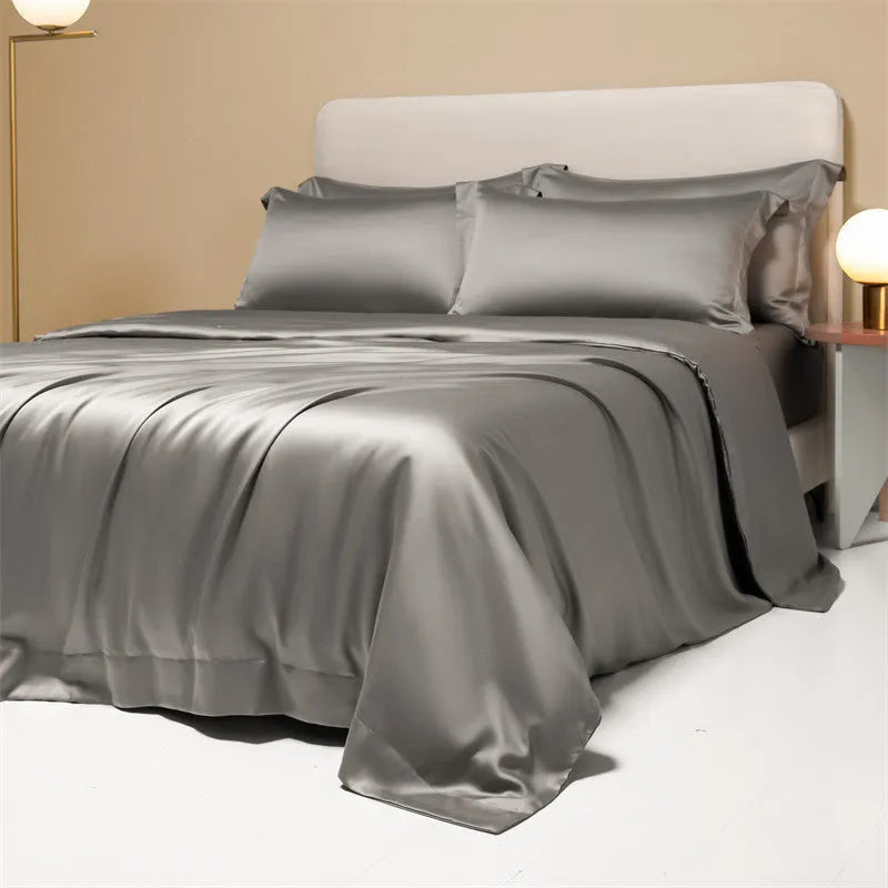Solid colour Tencel Lyocell bed linen set with quilt cover and pillowcases on a bed.