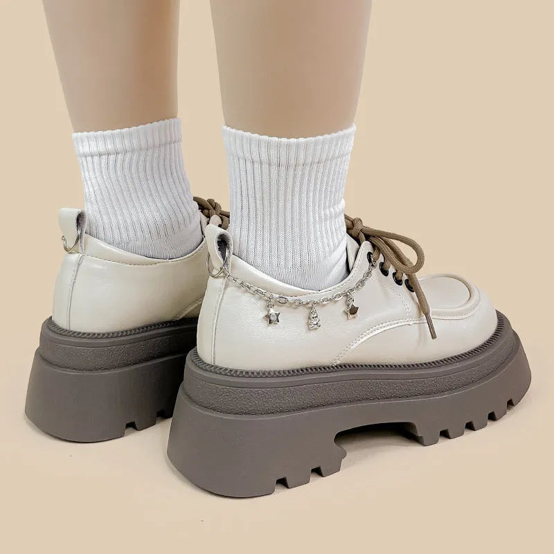 White women's platform Mary Jane shoes with chunky heel and front lace-up detail.