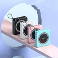 Mini clock charger portable power bank in an alloy case, shown in mint green, with multiple USB output ports.