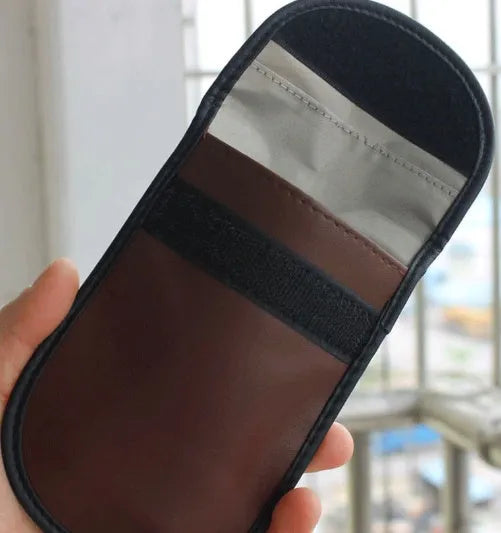 Black microfiber Faraday cage car key signal blocker case measuring 13.5 by 9.5 centimetres
