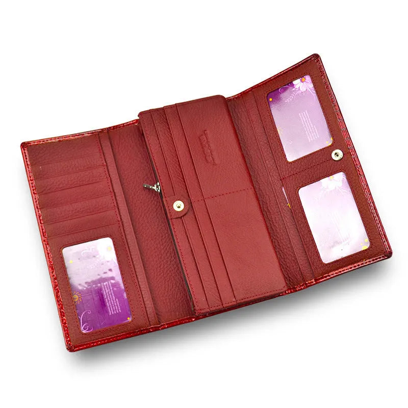Women's patent leather coin purse with crocodile pattern in wine red colour showing pigskin lining