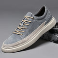 Men's grey casual leather skate shoes with round toe and low-top design on a rubber sole.