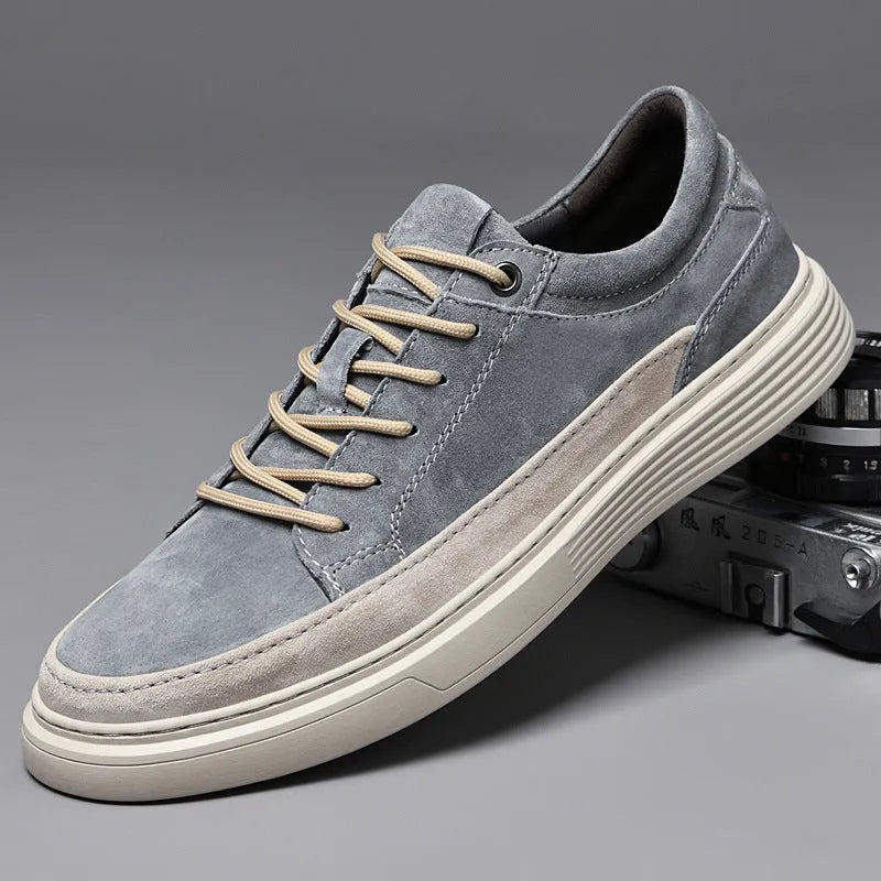 Men's grey casual leather skate shoes with round toe and low-top design on a rubber sole.