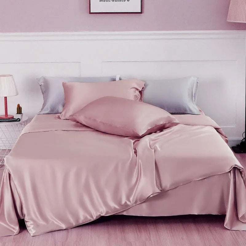 Pure silk duvet cover in a solid colour showing its sheen and texture, laid flat on a bed.